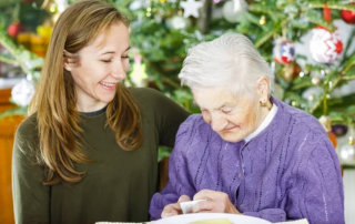 A tender Christmas moment as a young woman gives a thoughtful gift to an elderly lady in hospice care.